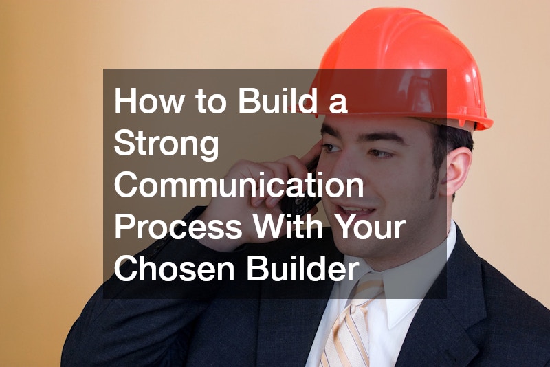 a man wearing a suit and a hard hat talking on the phone